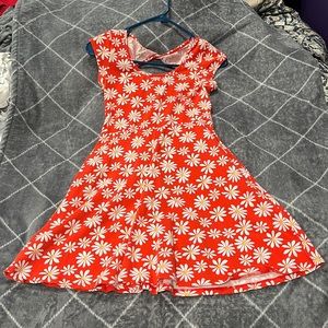 Orange sundress with white flowers